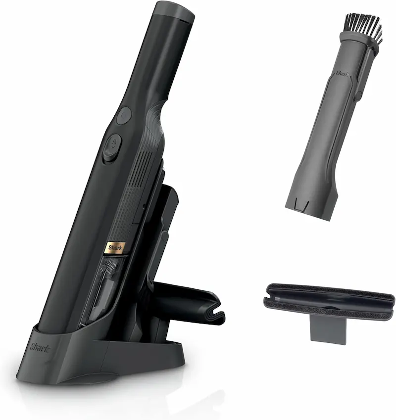 Sleek and lightweight Shark Wandvac handheld vacuum sitting on a modern kitchen countertop charging dock.